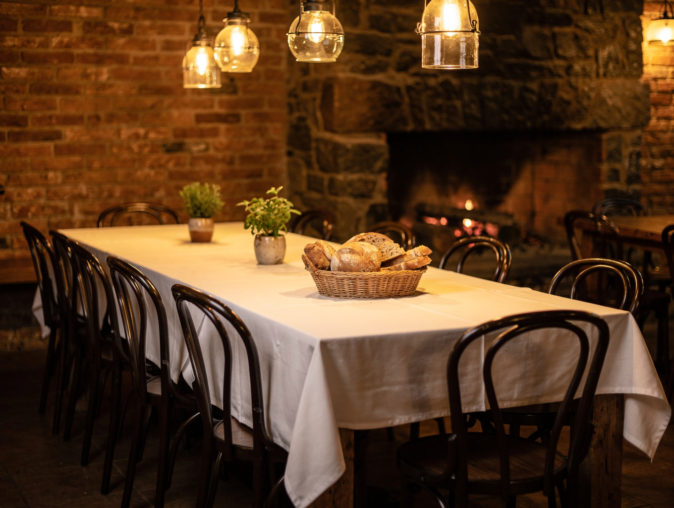 Warm ambient Italian dining room with stone walls and wooden tables